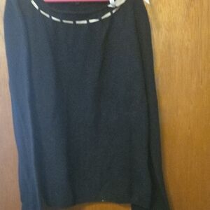 ECI Black sweater with pibk ribbon along neck line with delicate bow on left.
